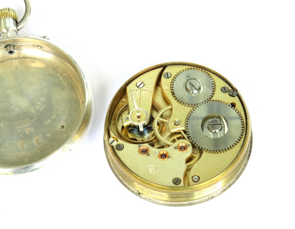 An antique open-face silver pocket watch featuring a white enamel dial with black Roman numerals and a subsidiary seconds dial. View III