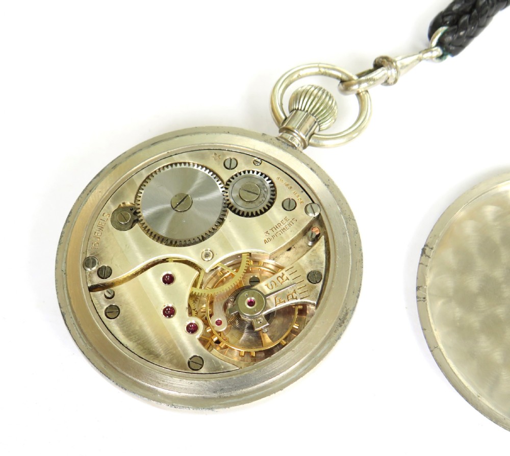 A 1940s GSTP British military open-face pocket watch featuring a white dial, black Arabic numerals, a sub-seconds dial, and a black braided leather watch fob with a T-bar. View III