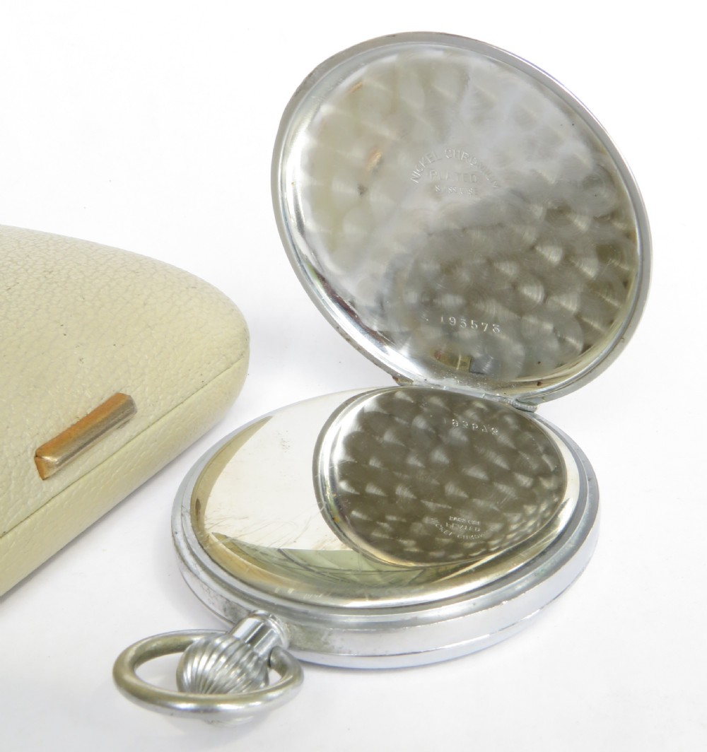 A 1950s Bravingtons Renown open-face pocket watch with a cream dial, black Arabic numerals, and blued steel hands, set inside its cream presentation case. View III