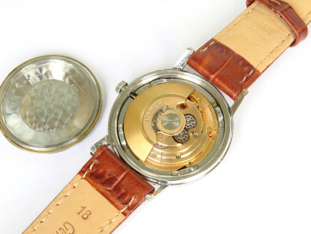 A gents 1950s Festina automatic wristwatch featuring a champagne dial, silver-tone case, and brown leather strap. View III