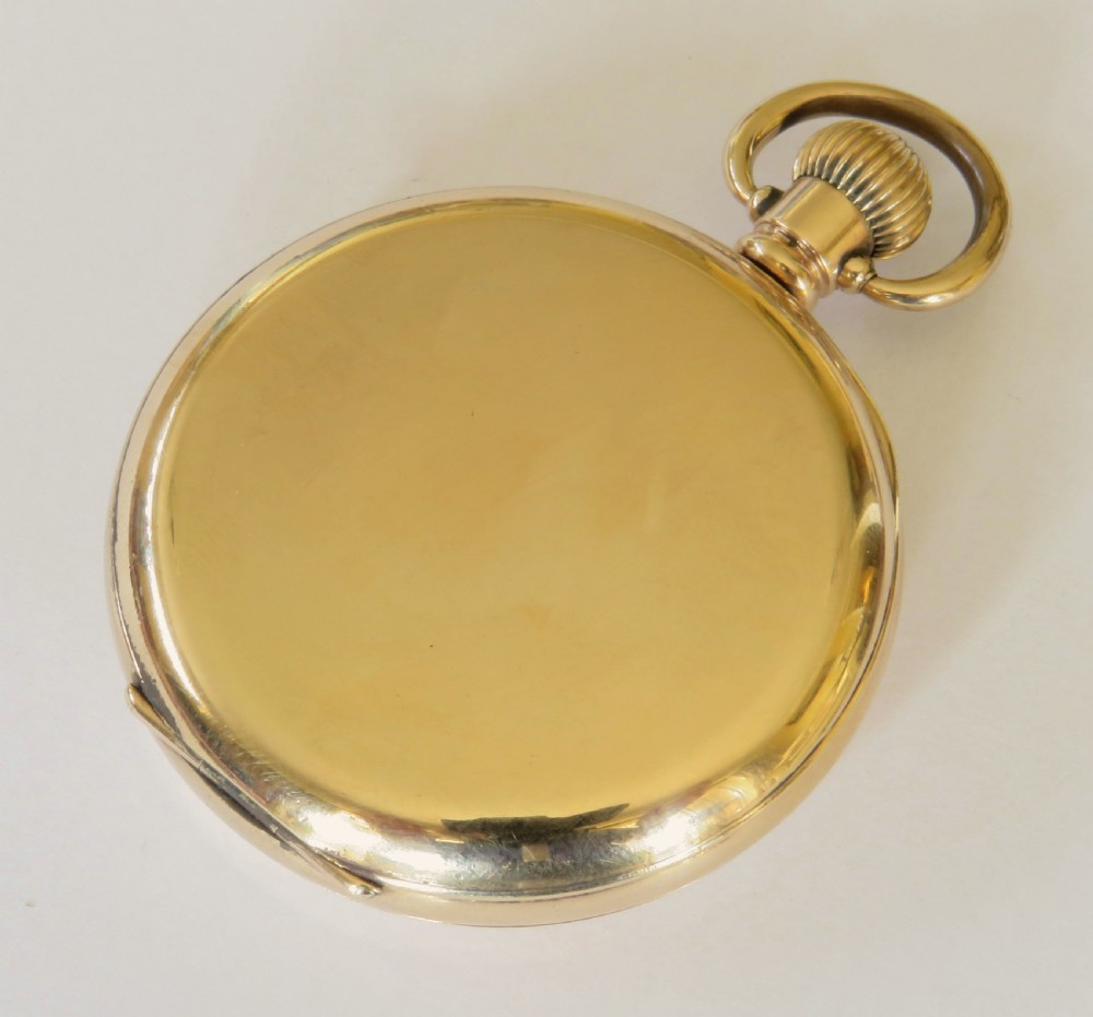 An open face stem winding gold pocket watch featuring a white enamel dial with black Arabic numerals and a subsidiary seconds subdial. View V
