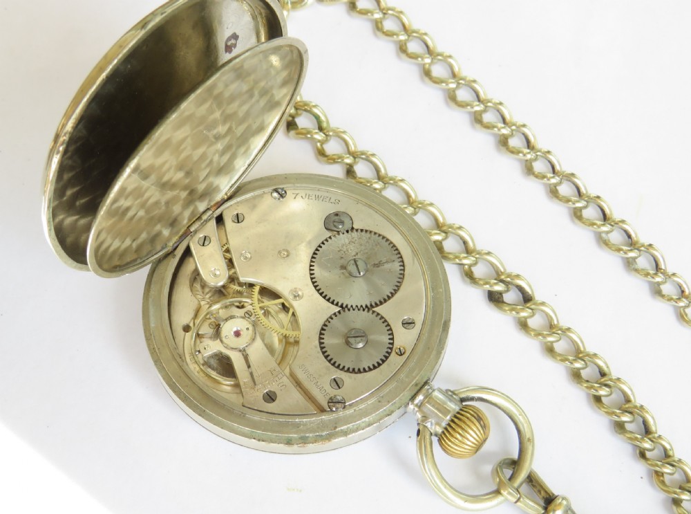 A 1920s Cyma open-face pocket watch featuring a white enamel dial with black Arabic numerals, a sub-seconds dial, and an attached link chain with a T-bar. View III