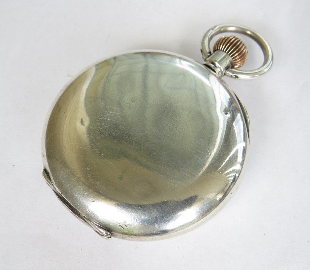 An antique silver open-face pocket watch featuring a white enamel dial with Roman numerals and a subsidiary seconds dial. View V