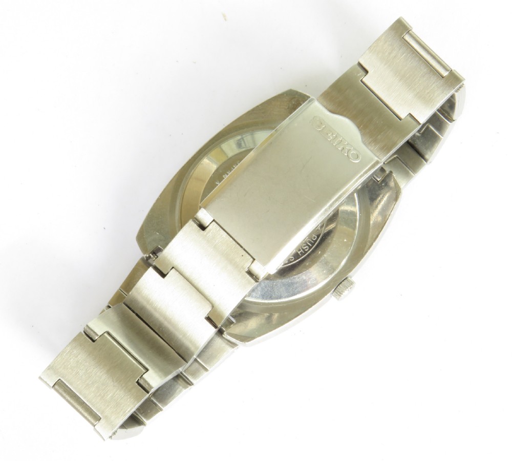 A gents Seiko Lord Matic stainless steel automatic wristwatch featuring a black dial face with day-date display and integrated steel link bracelet. View IV