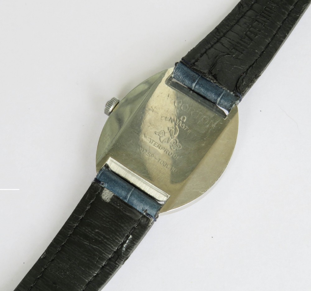 A 1960s gents Omega Seamaster Cosmic wristwatch featuring a stainless steel cushion case, silver dial with date display, and a blue leather strap. View III