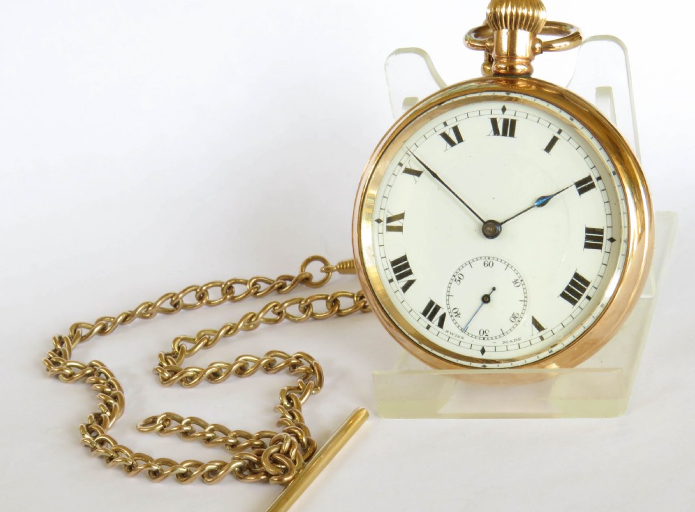 An antique gold-toned open-face pocket watch featuring a white enamel dial with black Roman numerals, blued steel hands, a subsidiary seconds dial, and an attached gold-toned Albert chain. View II