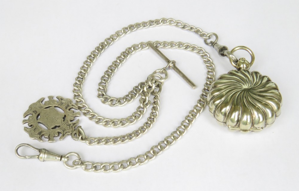 An antique sterling silver double Albert pocket watch chain featuring curb links, a T-bar, two swivel clasps, an engraved fob medal, and a fluted sovereign holder.