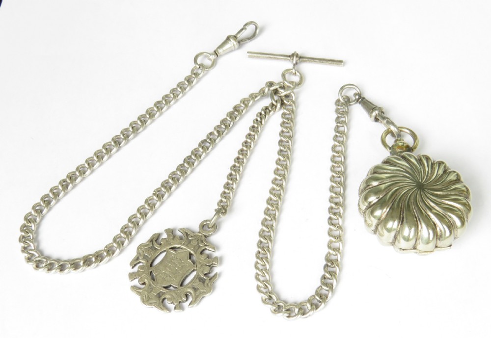 An antique sterling silver double Albert pocket watch chain featuring curb links, a T-bar, two swivel clasps, an engraved fob medal, and a fluted sovereign holder. View II