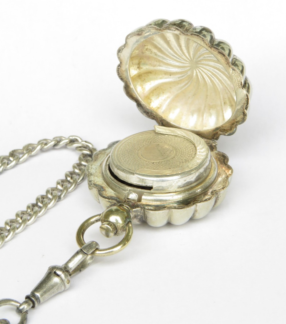 An antique sterling silver double Albert pocket watch chain featuring curb links, a T-bar, two swivel clasps, an engraved fob medal, and a fluted sovereign holder. View III