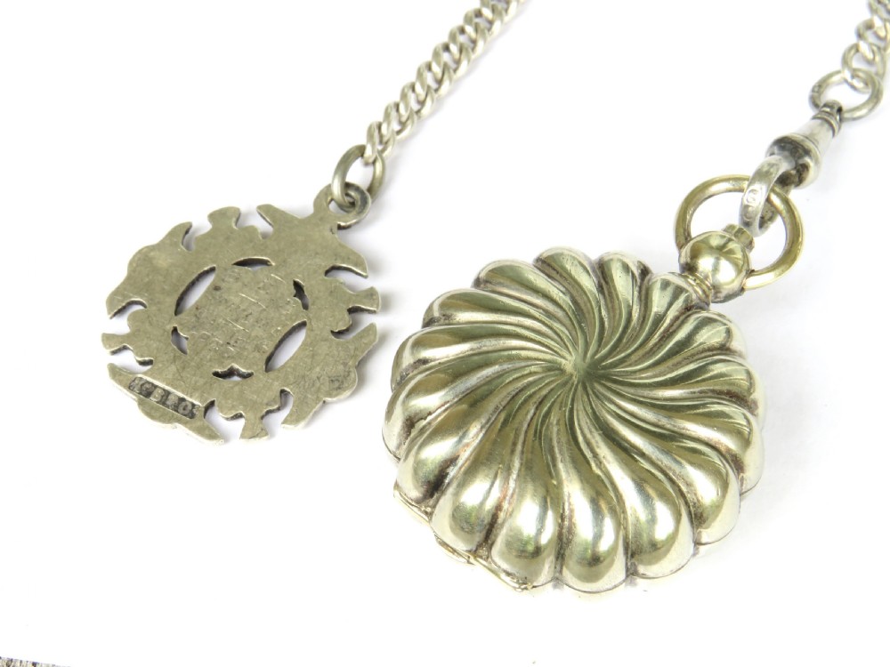 An antique sterling silver double Albert pocket watch chain featuring curb links, a T-bar, two swivel clasps, an engraved fob medal, and a fluted sovereign holder. View IV