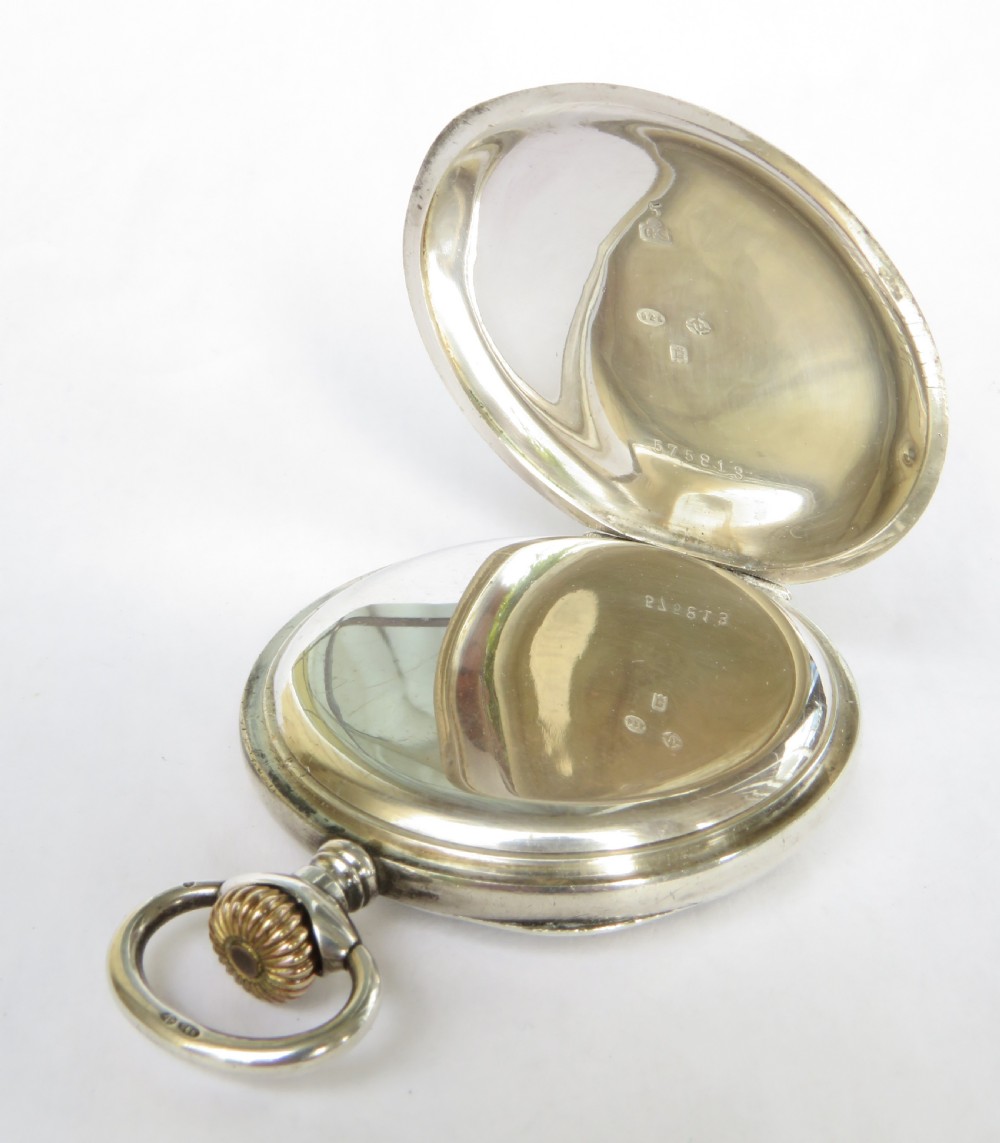 An antique open-face silver pocket watch featuring a white enamel dial with black Roman numerals and a small sub-seconds dial. View III
