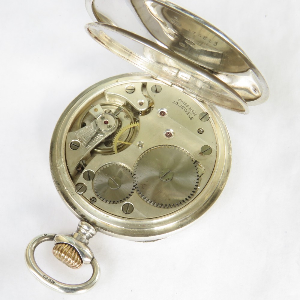 An antique open-face silver pocket watch featuring a white enamel dial with black Roman numerals and a small sub-seconds dial. View IV