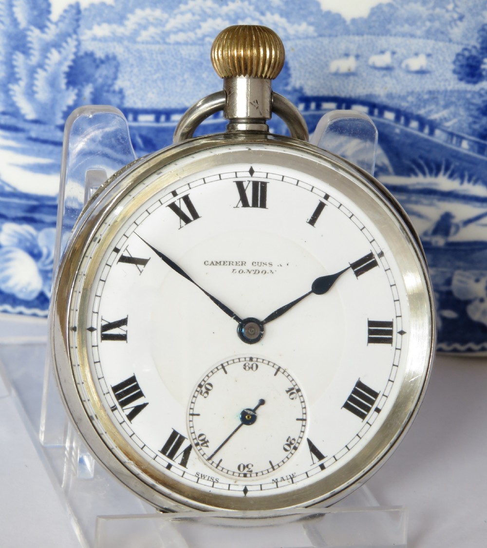 An open-face antique silver pocket watch featuring a white enamel dial with black Roman numerals and a subsidiary seconds sub-dial. View II