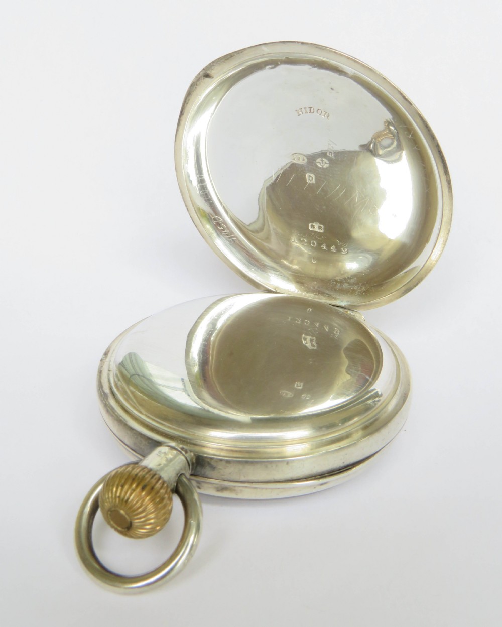 An open-face antique silver pocket watch featuring a white enamel dial with black Roman numerals and a subsidiary seconds sub-dial. View III