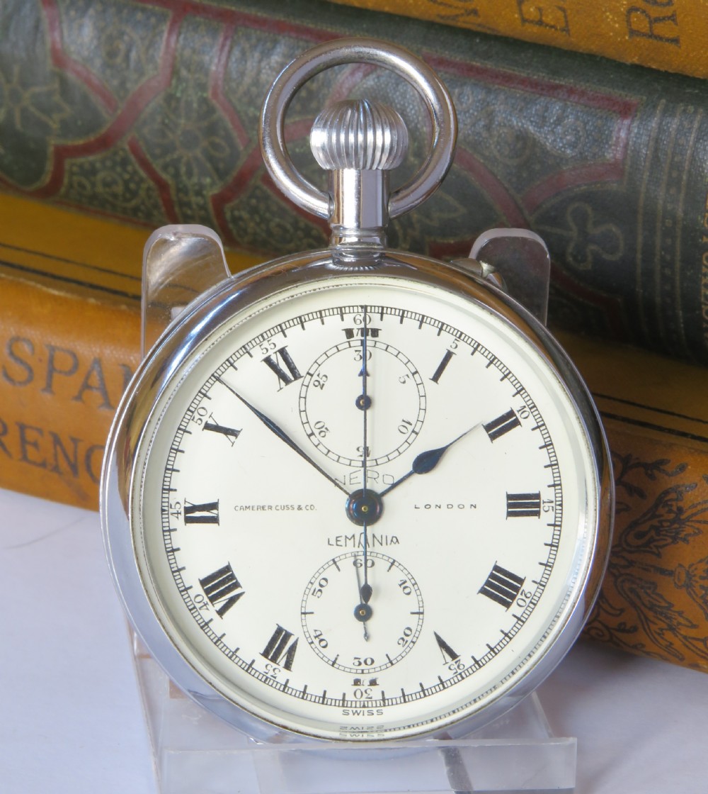 A 1930s open-face chronograph pocket watch featuring a white dial with Roman numerals, two subsidiary dials, and a chrome-plated metal case. View II