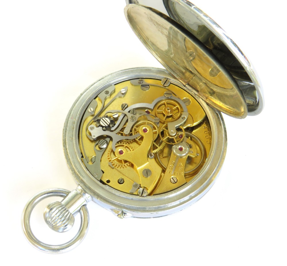 A 1930s open-face chronograph pocket watch featuring a white dial with Roman numerals, two subsidiary dials, and a chrome-plated metal case. View IV