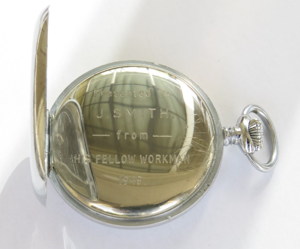 A 1940s silver-toned open-face pocket watch featuring a white enamel dial signed J W Benson London with black Arabic numerals and a subsidiary seconds dial. View III