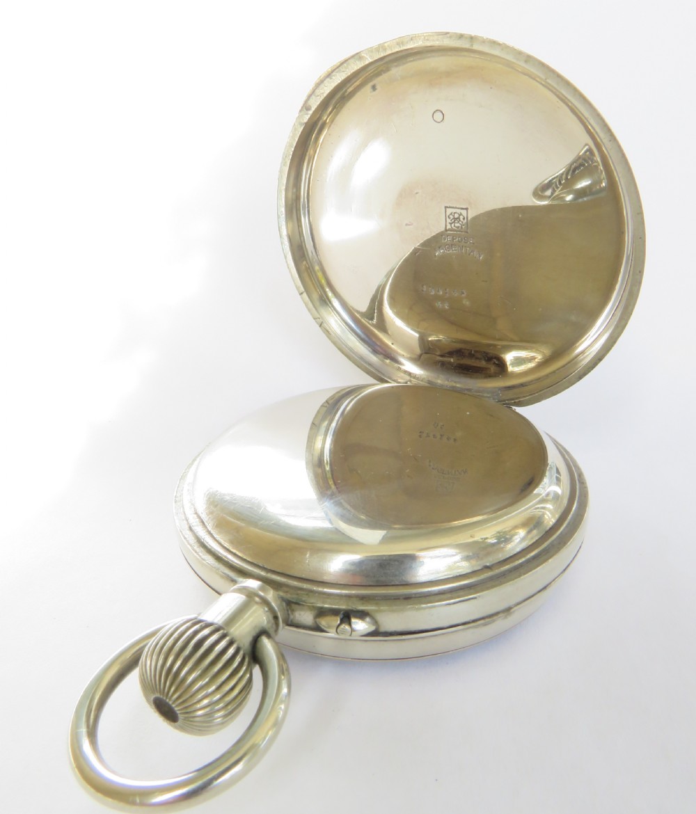 An antique Edwardian Goliath pocket watch featuring a black dial with circular mother-of-pearl cartouche hour markers, Roman numerals, and a gold-tone bezel ring. View III