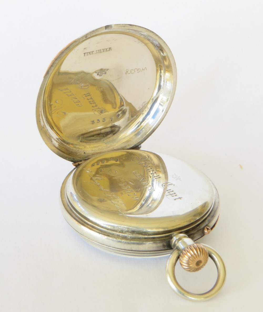 An antique Henry Capt silver open-face pocket watch featuring a white enamel dial with black Roman numerals and a rose gold winding crown. View IV