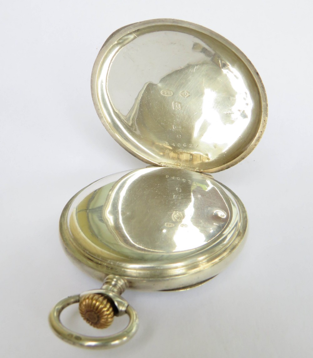 An open-face antique Swiss silver pocket watch featuring a white enamel dial with black Roman numerals and a subsidiary seconds sub-dial. View III