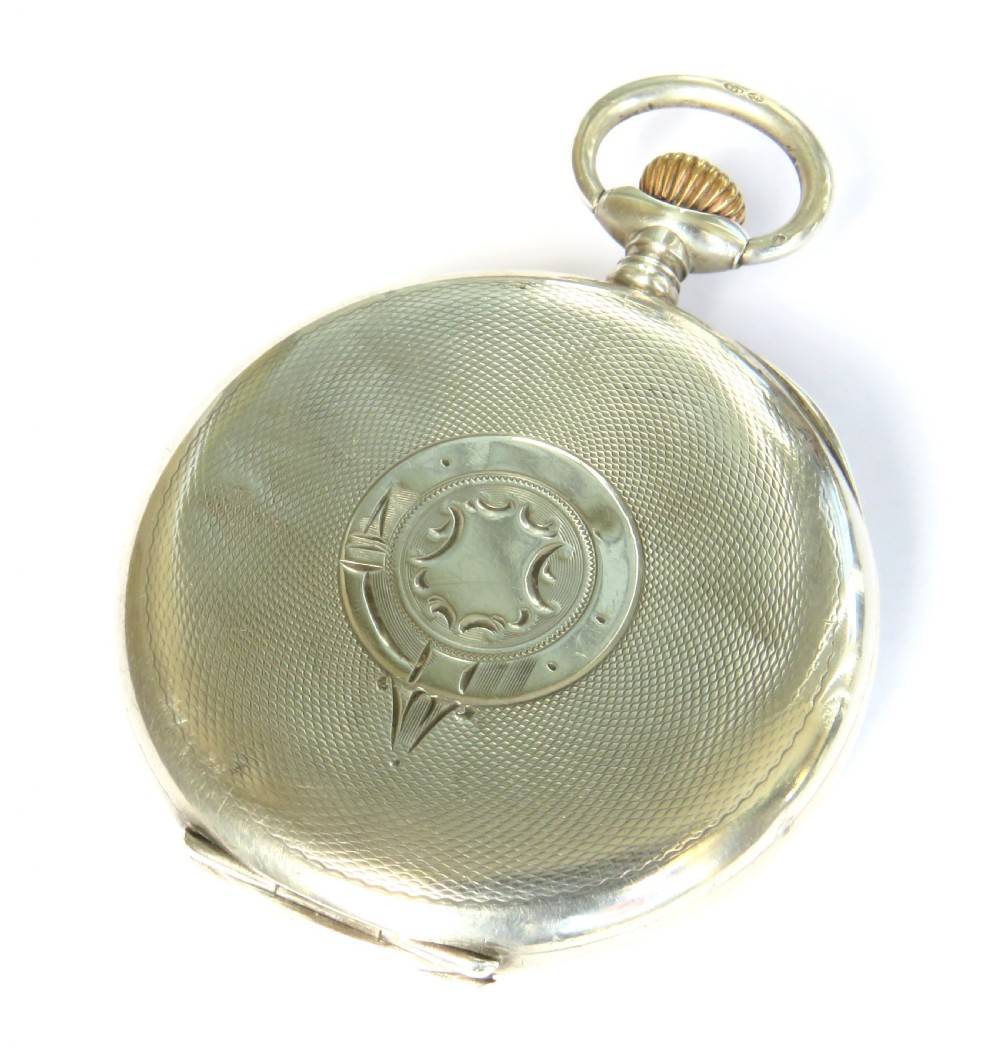 An open-face antique Swiss silver pocket watch featuring a white enamel dial with black Roman numerals and a subsidiary seconds sub-dial. View V