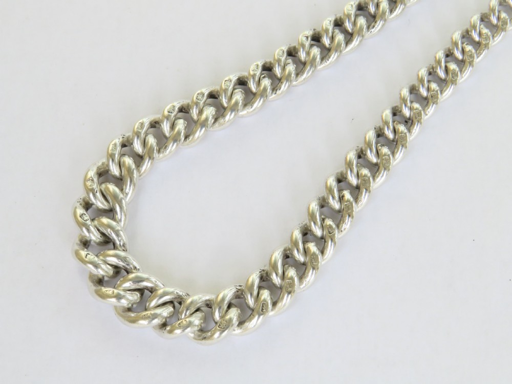 A sterling silver curb link pocket watch chain featuring a T-bar, swivel clasp, and an engraved shield-shaped darts medallion fob. View II