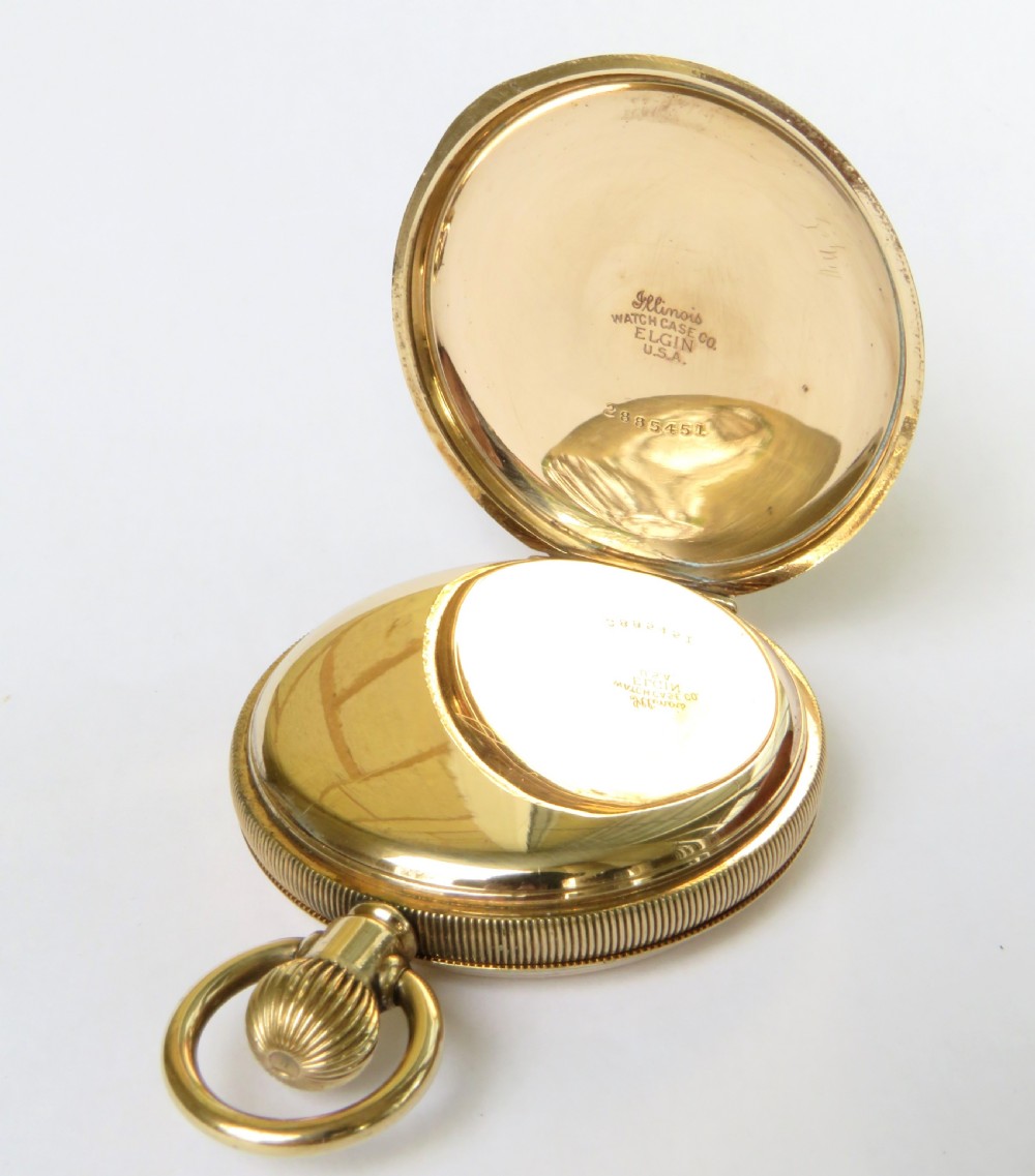 An open antique gold-toned Waltham full hunter pocket watch displaying a white enamel dial with black Roman numerals and a subsidiary seconds dial. View III