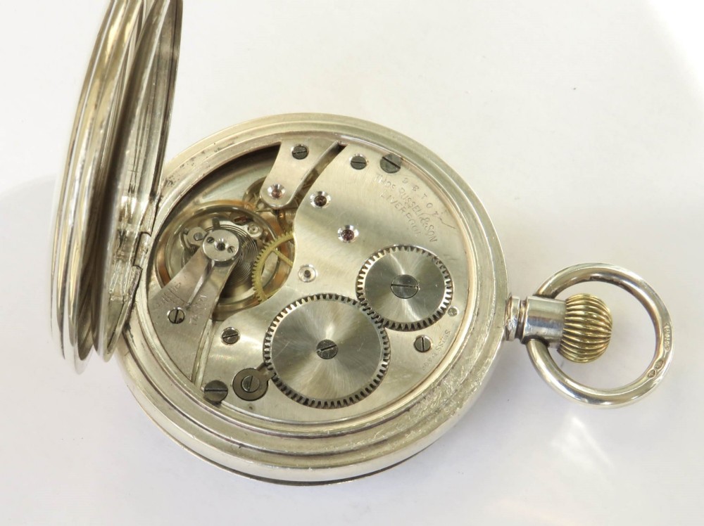 An open antique silver full hunter pocket watch displaying a white enamel dial with black Roman numerals and a subsidiary seconds dial. View IV