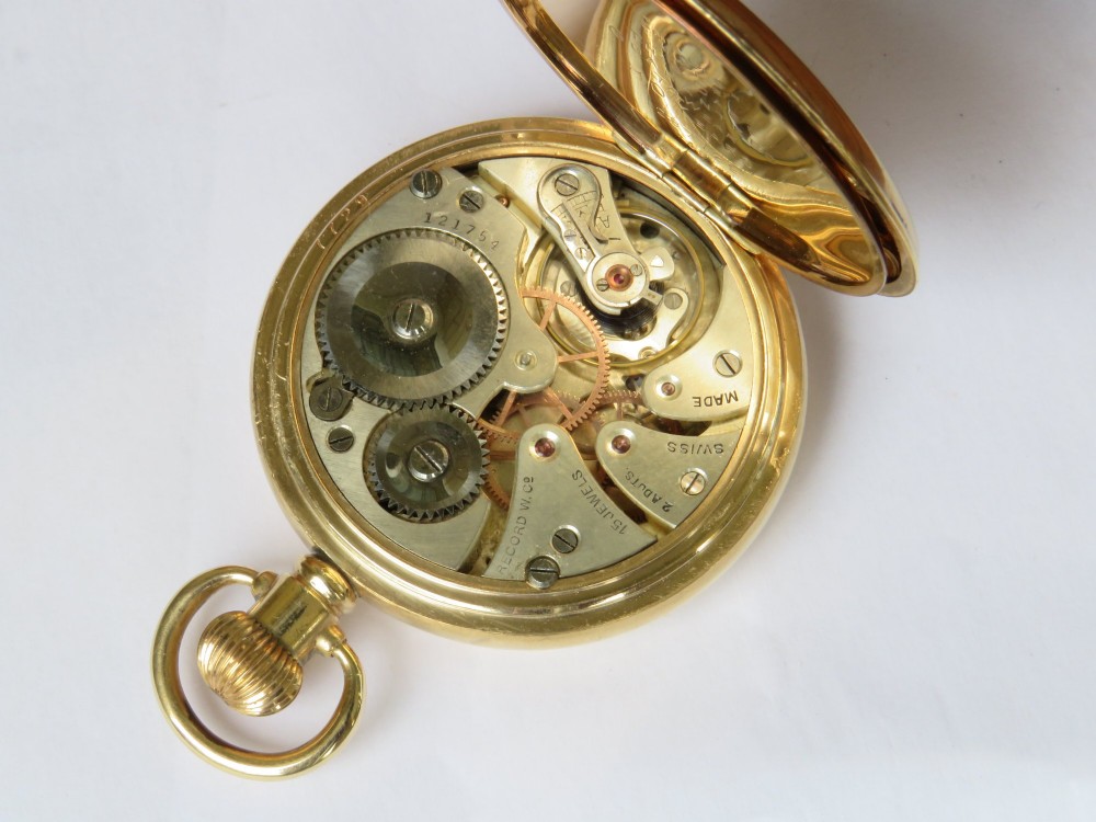 An open vintage gold-plated full hunter pocket watch displaying a white enamel dial with black Arabic numerals and a subsidiary seconds dial. View IV