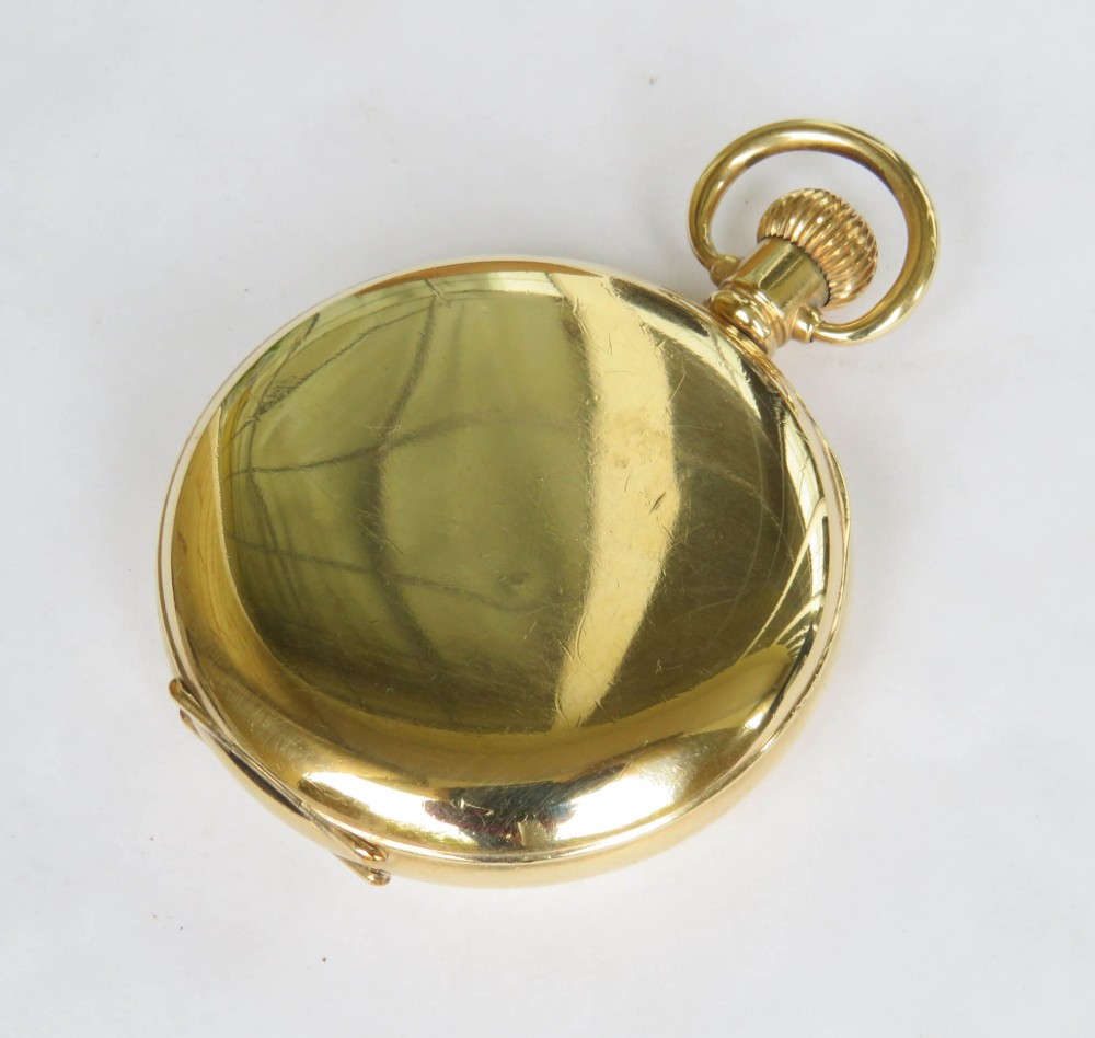 An open vintage gold-plated full hunter pocket watch displaying a white enamel dial with black Arabic numerals and a subsidiary seconds dial. View V