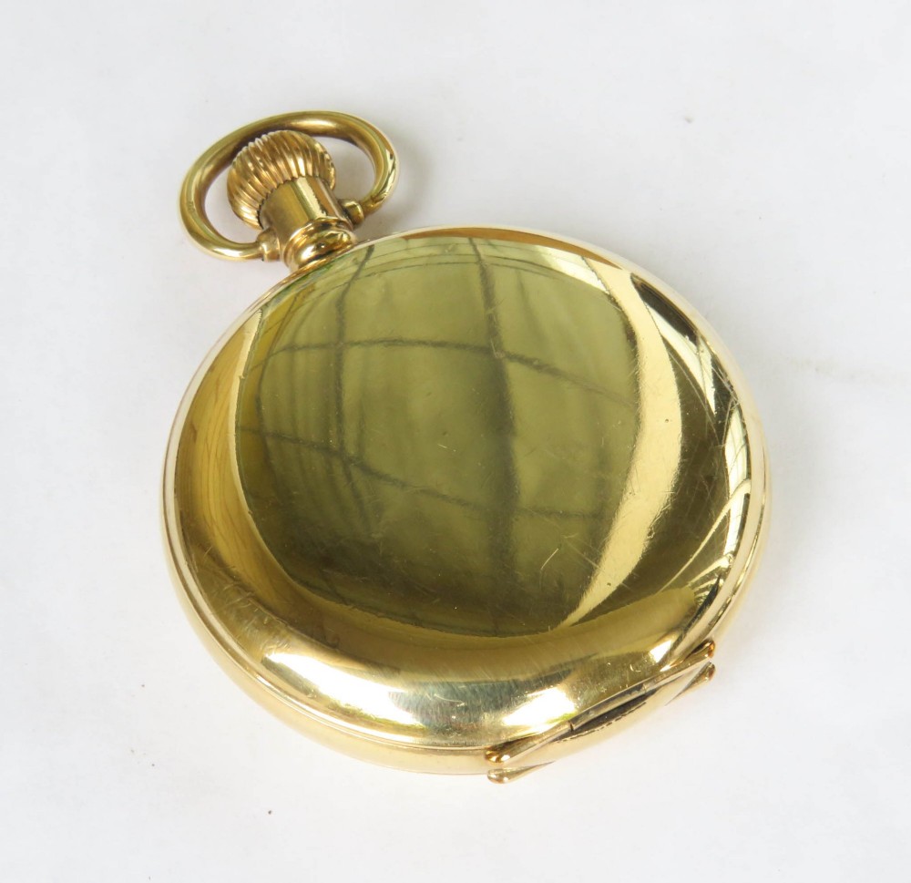 An open vintage gold-plated full hunter pocket watch displaying a white enamel dial with black Arabic numerals and a subsidiary seconds dial. View VI
