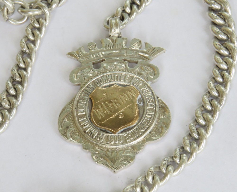 Victorian sterling silver curb link Albert watch chain with a T-bar anchor, swivel clasp, and central crowned shield fob medallion. View II