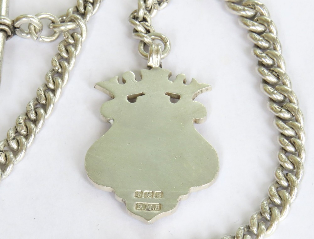 Victorian sterling silver curb link Albert watch chain with a T-bar anchor, swivel clasp, and central crowned shield fob medallion. View III