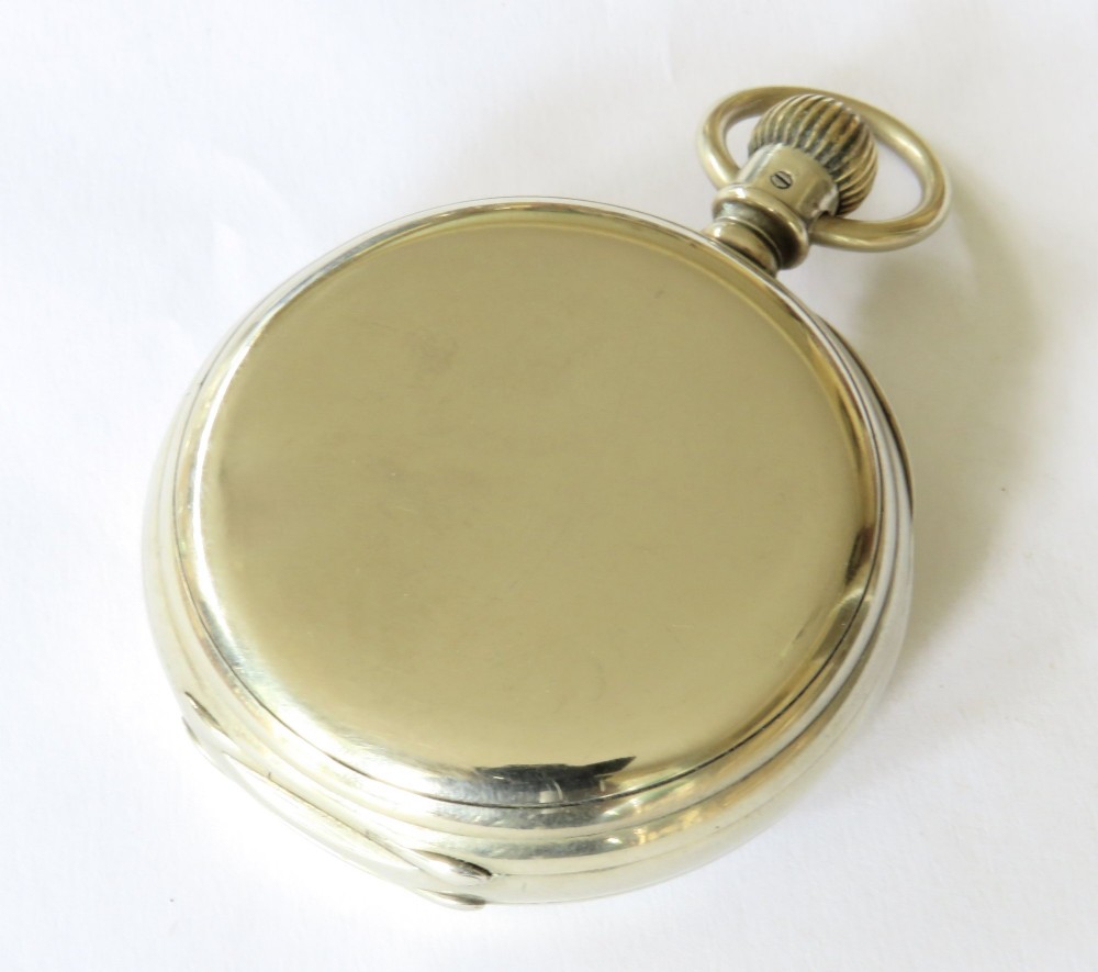 An antique open-face Longines pocket watch with a white enamel Roman numeral dial, connected to a silver-coloured curb chain with an enamelled fob medallion. View VIII