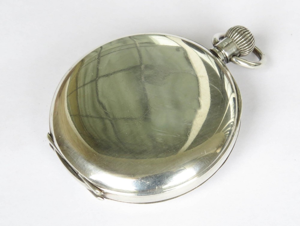 An open-face silver pocket watch displaying a white enamel dial with black Roman numerals and a subsidiary seconds sub-dial. View V