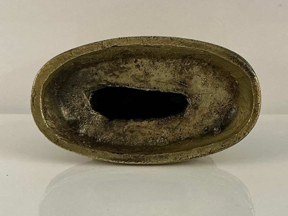A small 19th-century gilt bronze sculpture depicting a crouching rabbit on an oval moulded base. View VIII