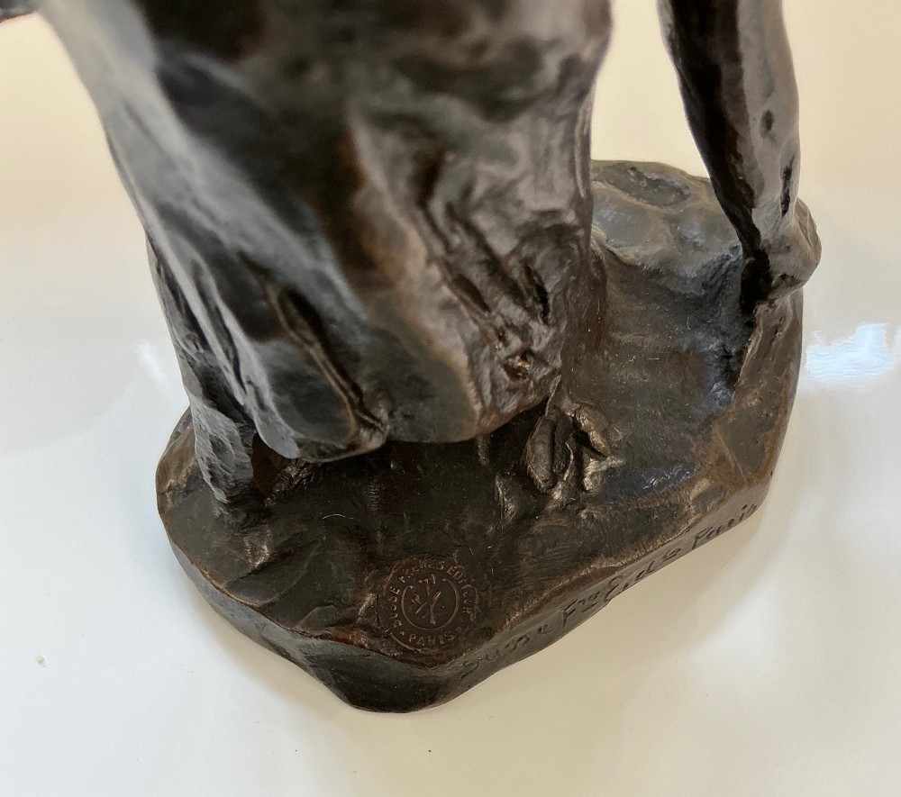 A dark brown patinated bronze sculpture of a bent female gleaner, mounted on an integral base with the incised signature Dalou. View III