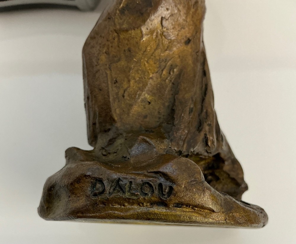 A patinated dark brown bronze sculpture by Jules Dalou depicting a bent female peasant figure carrying a heavy bundle. View V