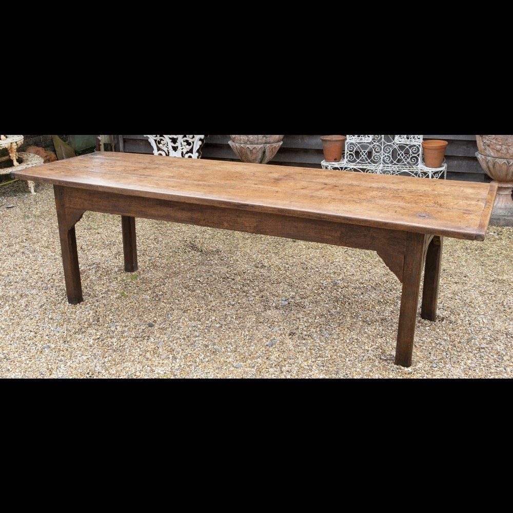 A long rectangular 18th-century solid oak farmhouse dining table with a wide plank top and straight square legs. View III
