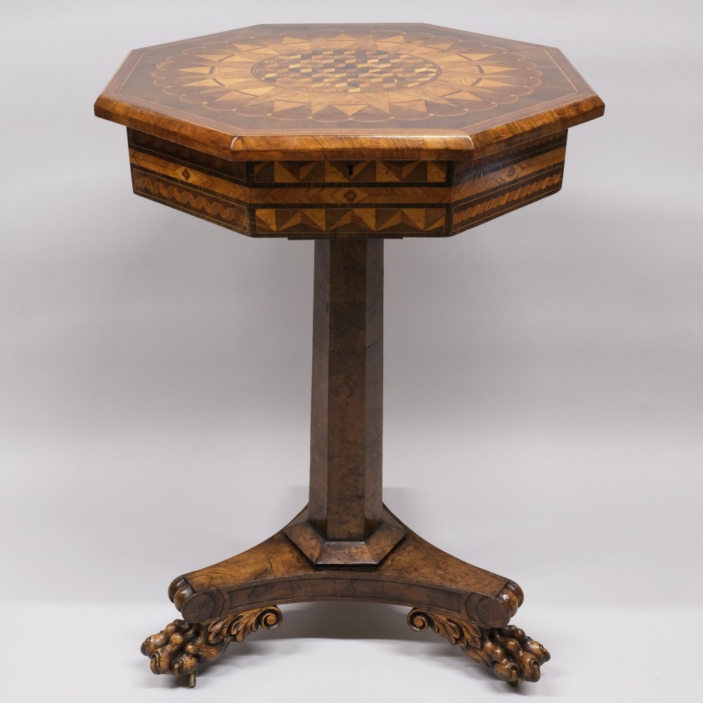 An early 19th-century octagonal work table featuring intricate geometric parquetry inlay, a faceted central column, and carved claw feet. View II