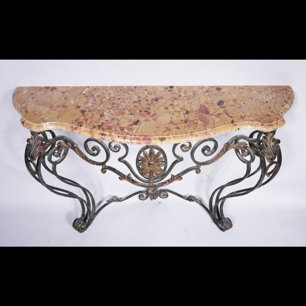 A 19th-century serpentine console table featuring a contoured marble top resting on a dark green wrought iron frame decorated with floral rosettes and scrollwork. View III