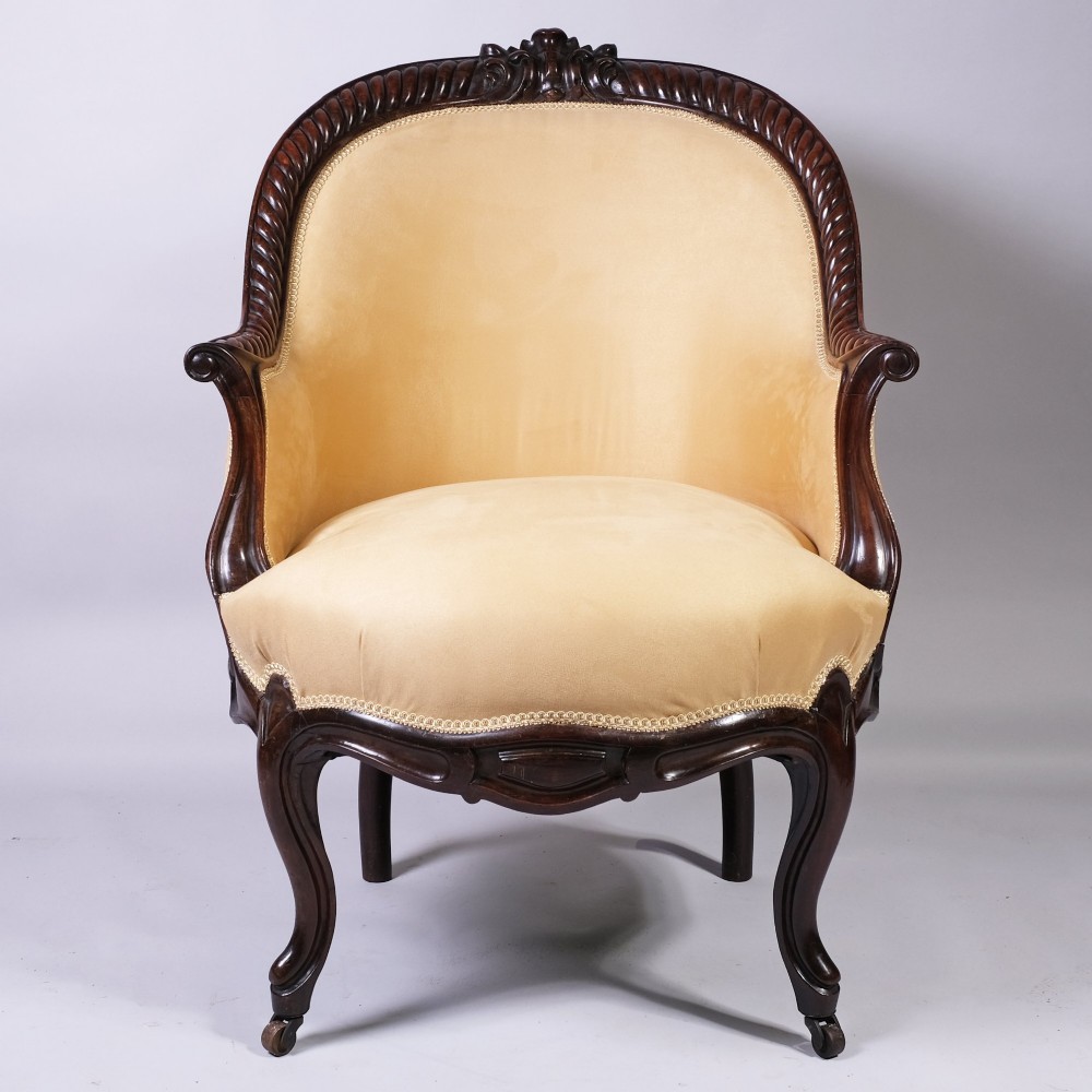 A pair of 19th-century armchairs crafted from dark Goncalo Alves wood featuring hand-carved showwood frames and cream velvet upholstery. View III