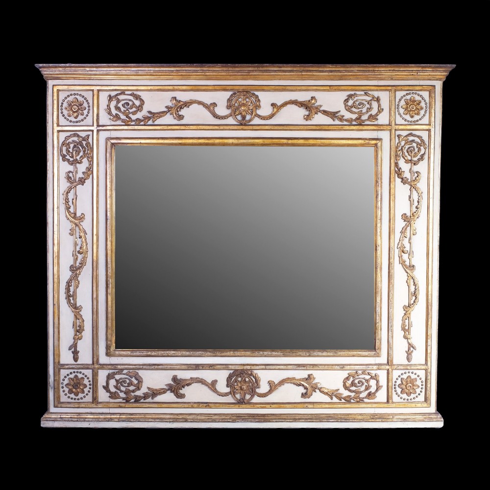 An early nineteenth-century rectangular overmantel mirror featuring a cream painted frame embellished with gold gilded foliate scrolls, rosettes, and moulded borders.