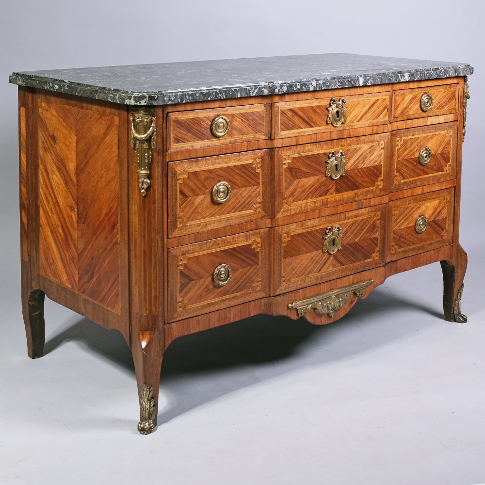 An 18th-century French Louis XVI walnut parquetry commode featuring three drawers with gilt bronze hardware and a grey marble top surface. View II