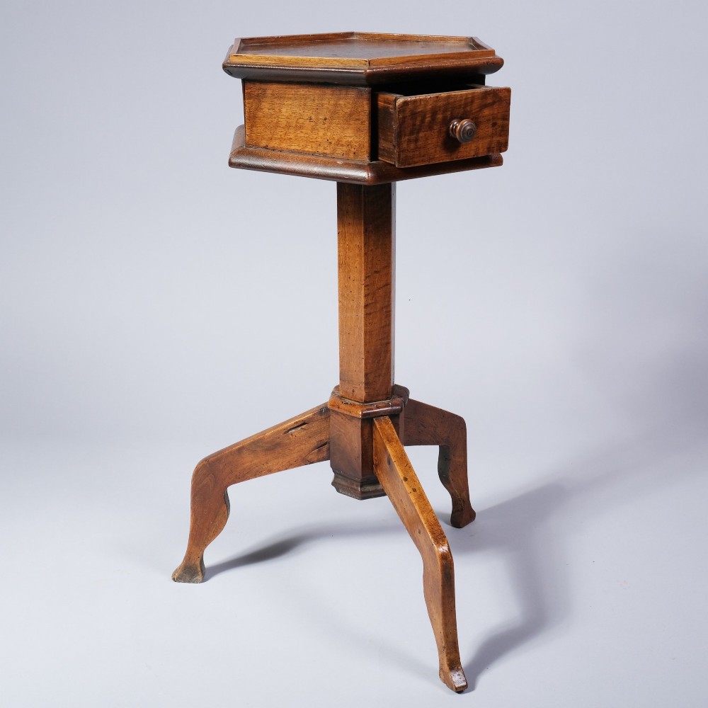 An early nineteenth-century fruitwood occasional table featuring an octagonal top with a single drawer on three downswept tripod legs. View III