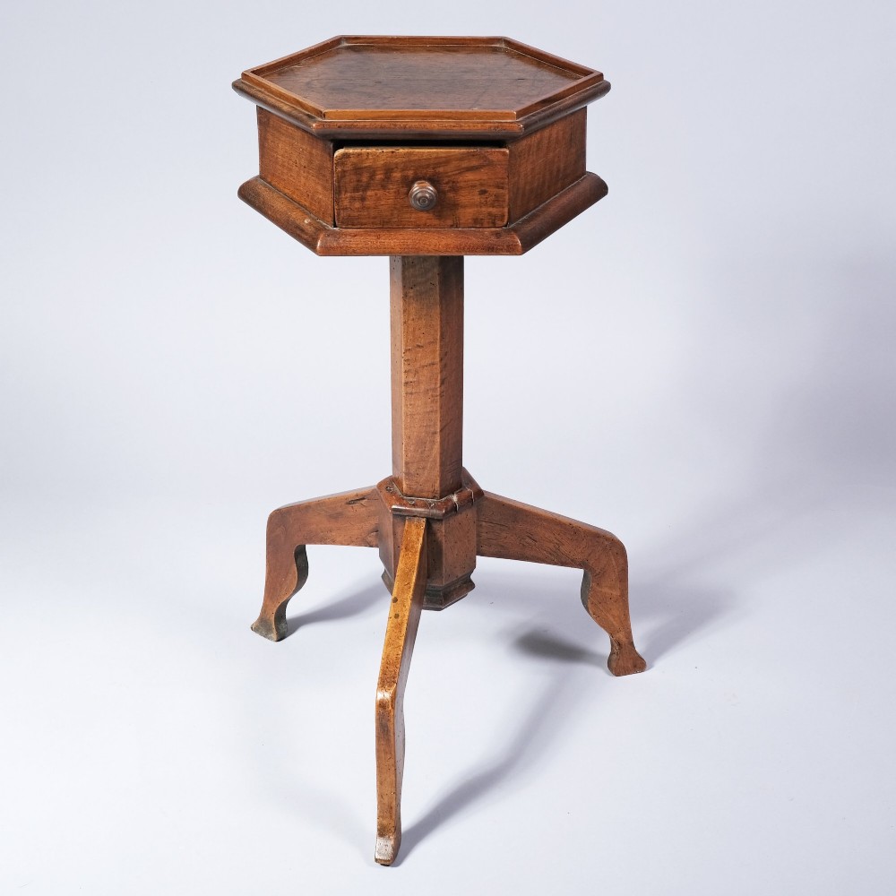 An early nineteenth-century fruitwood occasional table featuring an octagonal top with a single drawer on three downswept tripod legs. View IV