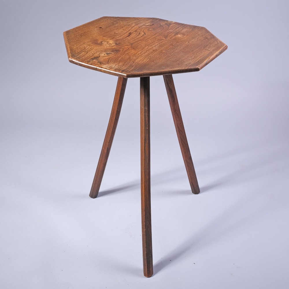 An early 19th-century ash wood side table featuring an octagonal top supported by three straight splayed legs.