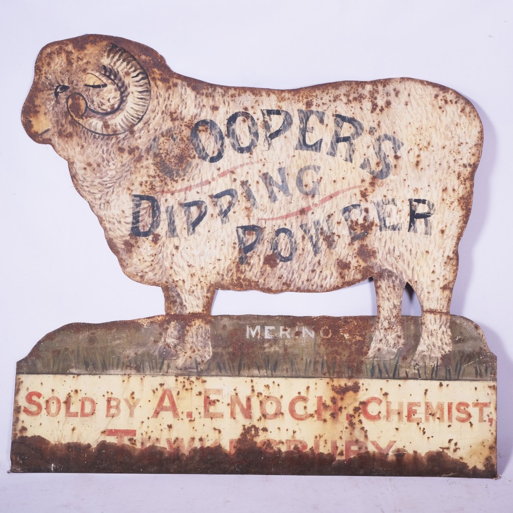 A 19th-century painted iron trade sign cut into the silhouette of a Merino ram, featuring lettering for Coopers Dipping Powder and A. Enoch Chemist Tewkesbury with visible surface rust.
