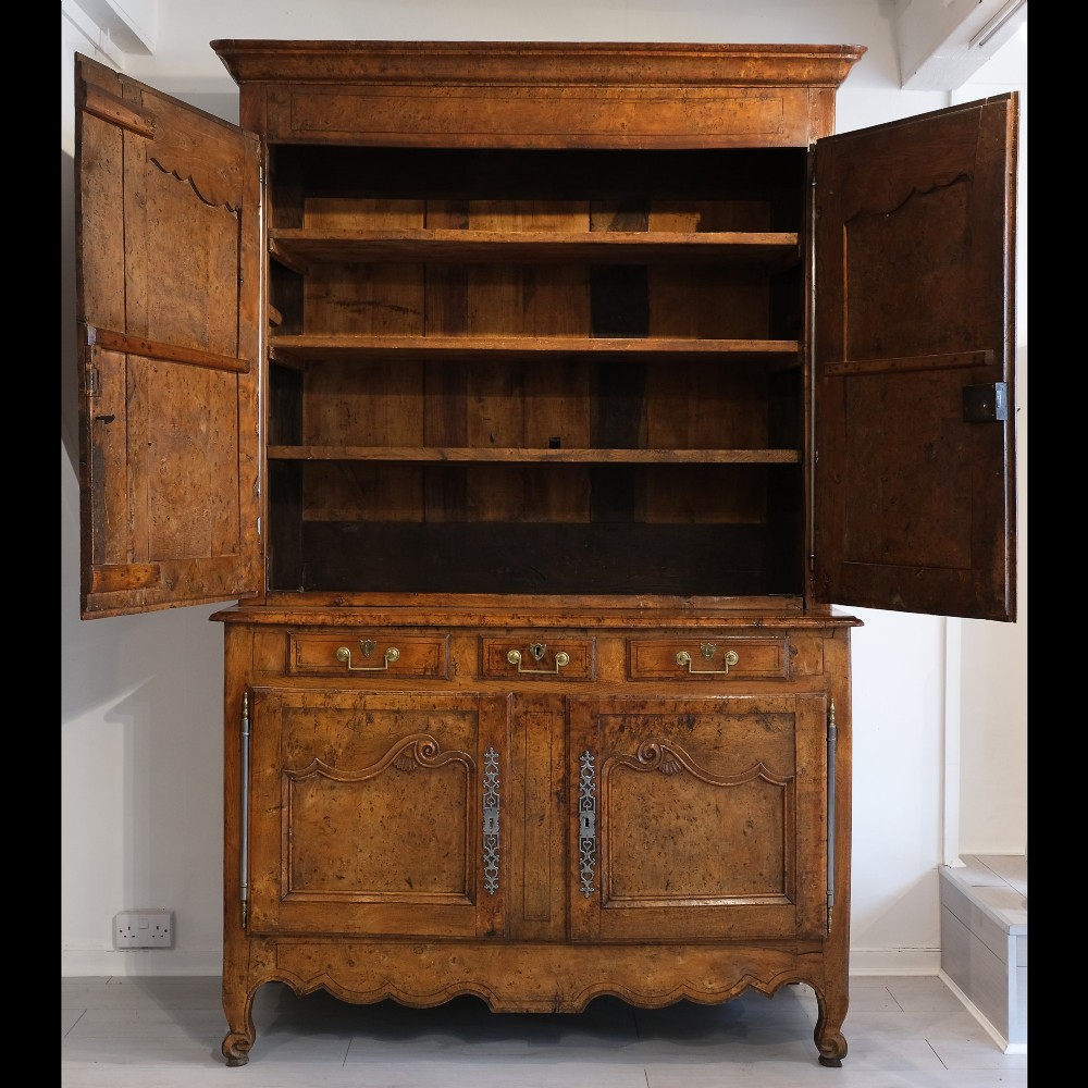 An 18th-century French provincial ash and elm two-part buffet deux corps cabinet featuring carved fielded panels, steel escutcheons, and long barrel hinges. View III