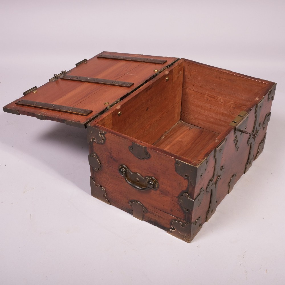 An early eighteenth-century rectangular camphor wood casket featuring ornate cut-out brass strapwork, corner brackets, and side handles. View III